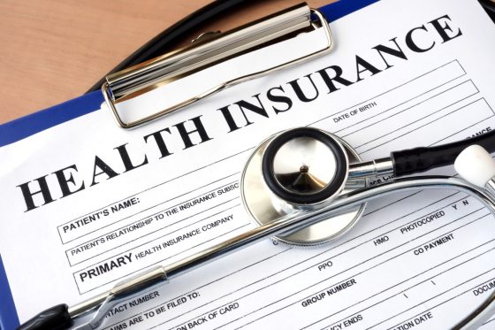 Close up of health insurance form with stethoscope