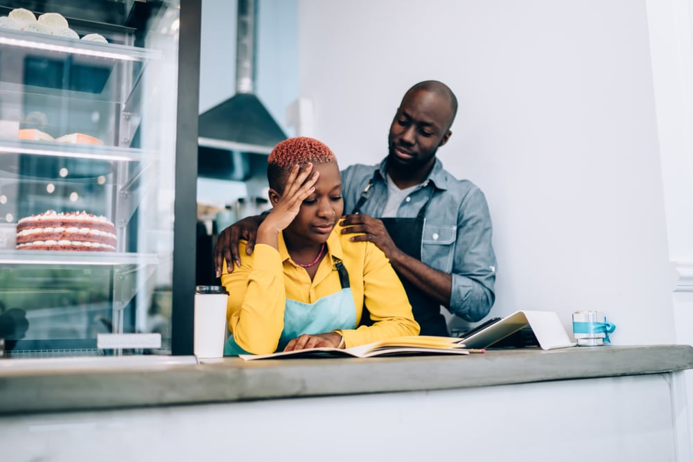 African-American business owners work through a challenging day