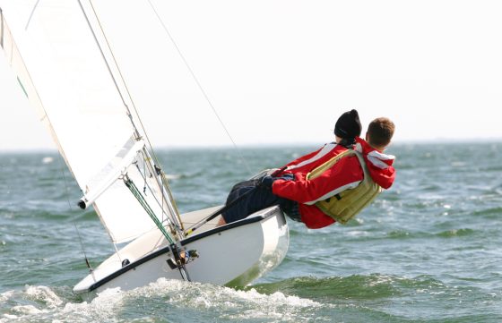 Two people sailing on a dinghy