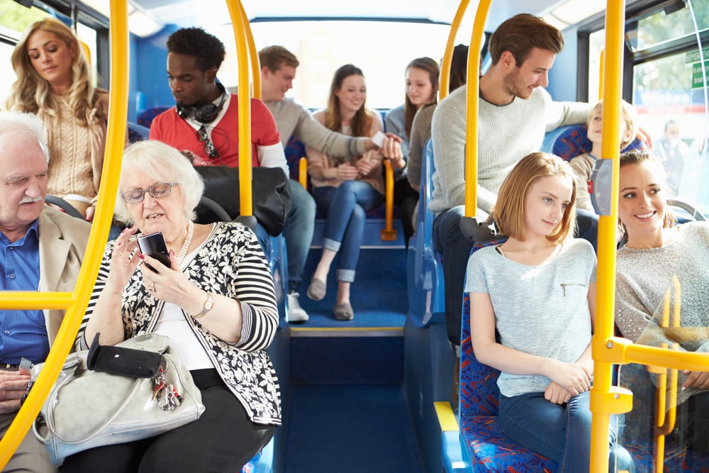 People riding public transportation to save money in California