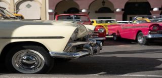 Vintage classic cars parked together at a car show, representing classic car insurance California coverage for collectible vehicles.