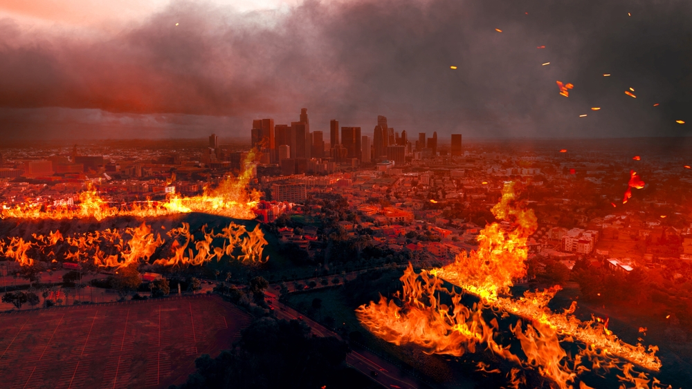 Wildfire burns with the city of Los Angeles in the background - cheap home insurance in California.