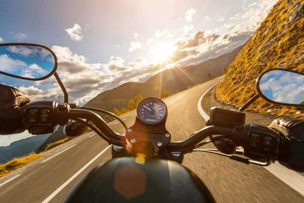 Viewpoint from motorcycle rider as they look over the handlebars at the California scenery. 