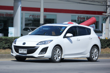 CHIANGMAI, THAILAND -NOVEMBER 5 2015:   Private car, Mazda3. Photo at road no.121 about 8 km from downtown Chiangmai, thailand.