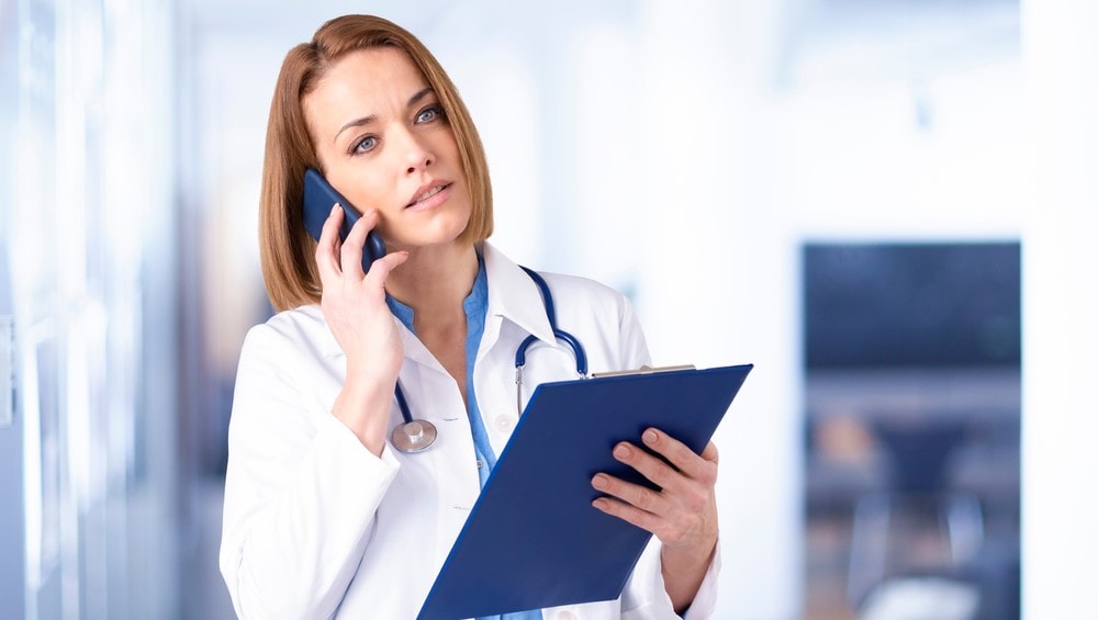 woman doctor answering a call telemedicine