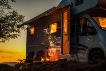 Used camper parked during a sunset