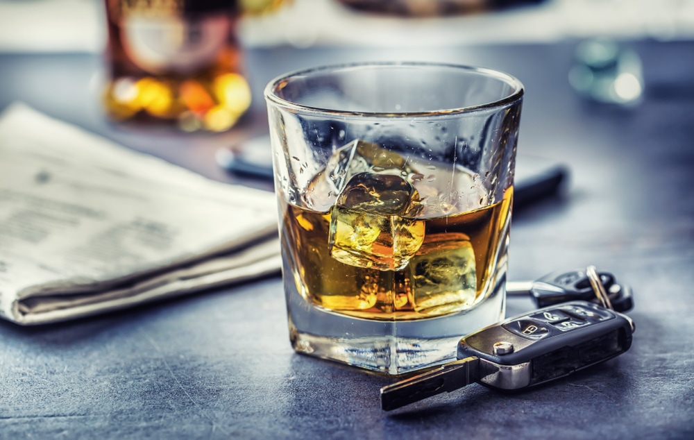 alcoholic drink and car keys on a table 