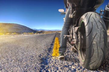 back view of motorcycle rider in california with insurance