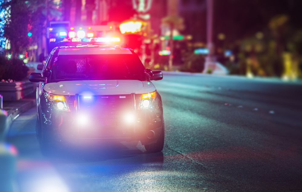 cop car with lights on at night