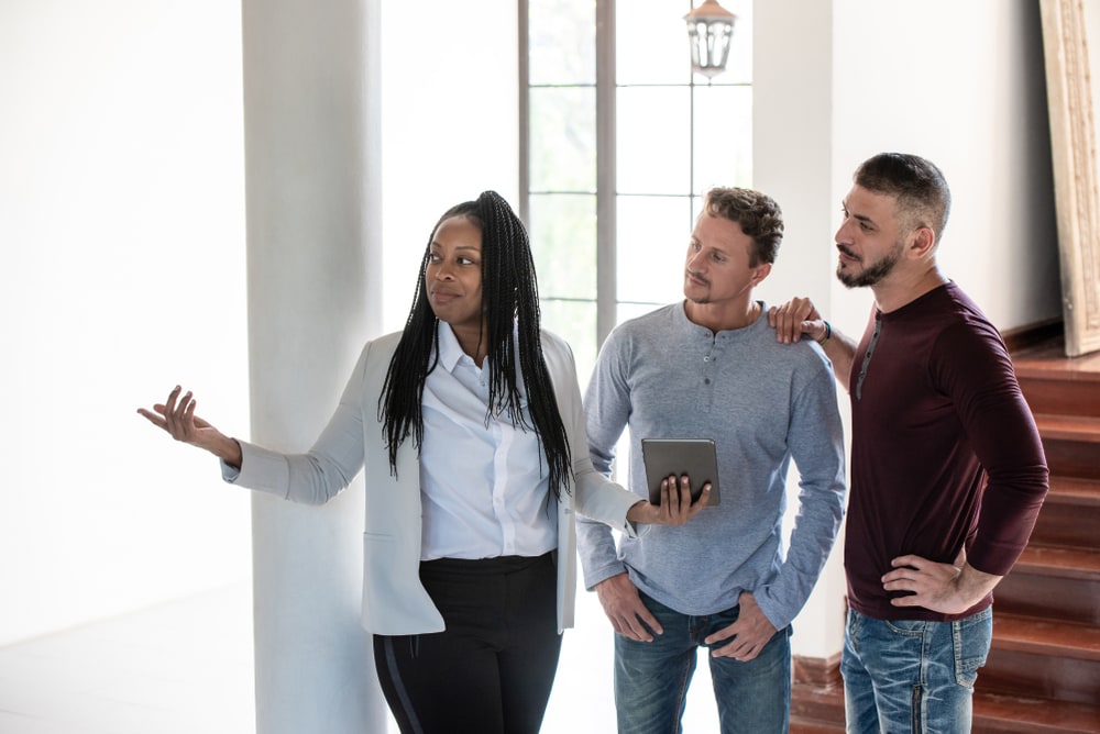 real estate agent working with young couple