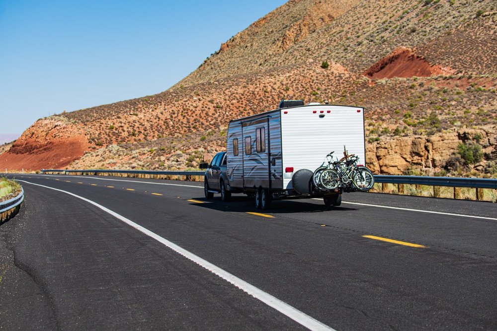 Camper being towed on a highway