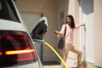 Millennial goes into house while electric car is charging