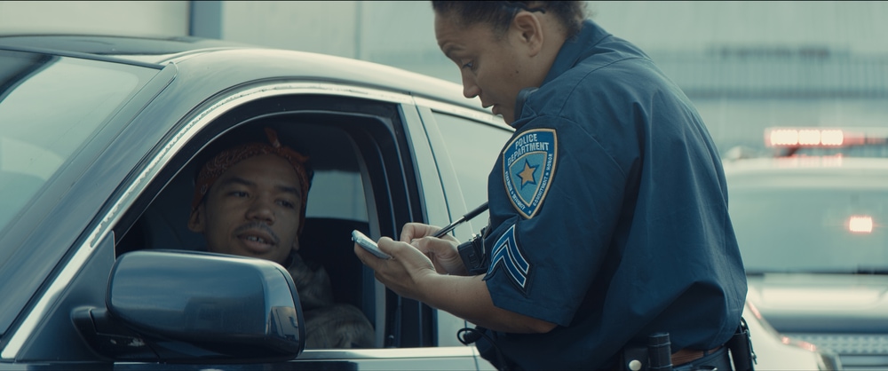 female cop pulling over driver