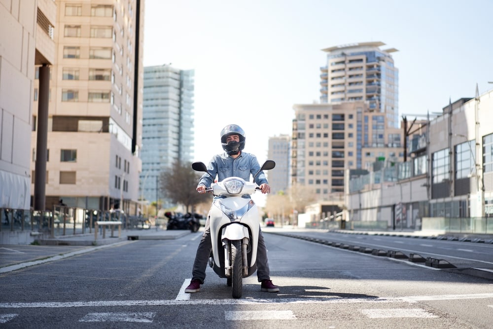 man on motorcycle on street