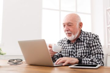 older caucasian man on laptop