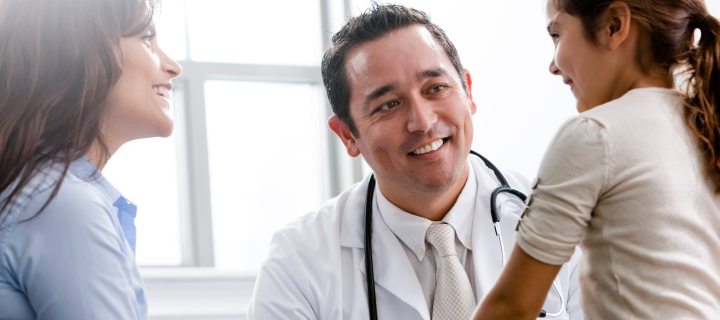 A mom and daughter talking with a doctor