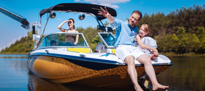 Family on a boat in a lake