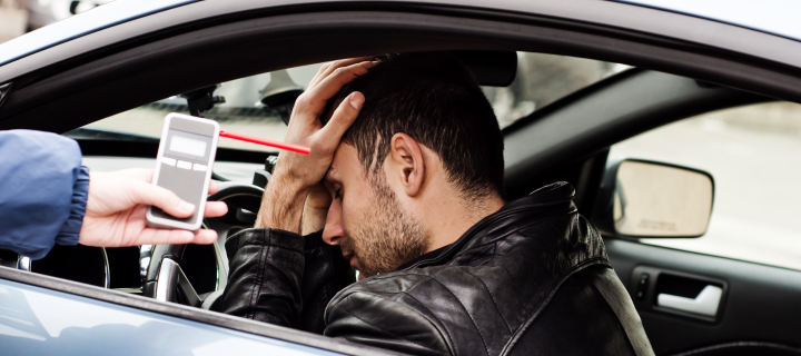 Man in car getting a sobriety check