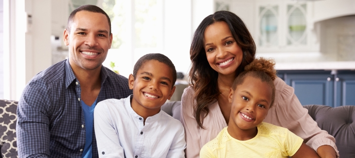 Young family relaxes at home in their rental unit.