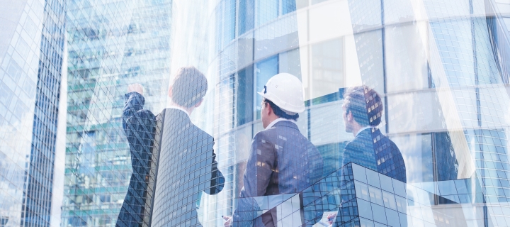 Group of business people discussing real estate project.